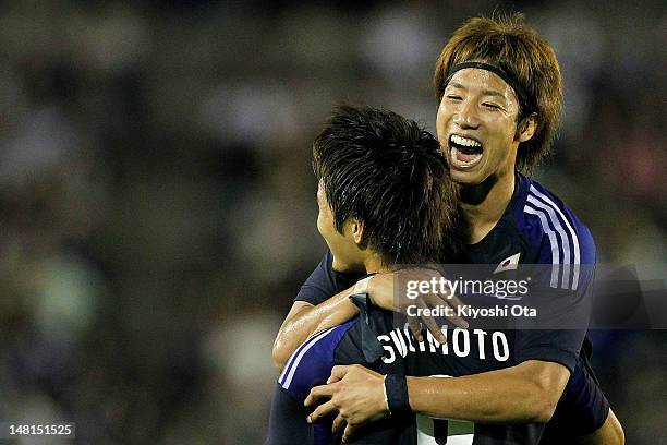 Kenyu Sugimoto of Japan celebrates his goal against New Zealand U-23 with his team-mate Yuki Otsu of Japan during the international friendly match...