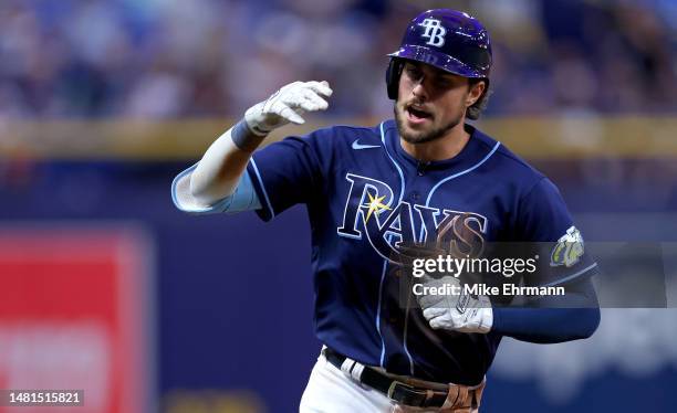 Josh Lowe of the Tampa Bay Rays is congratulated after hitting a home run in the seventh inning during a game against the Boston Red Sox at Tropicana...
