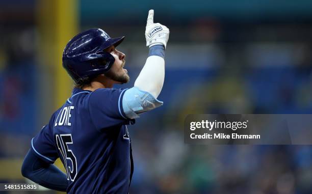 Josh Lowe of the Tampa Bay Rays is congratulated after hitting a home run in the seventh inning during a game against the Boston Red Sox at Tropicana...