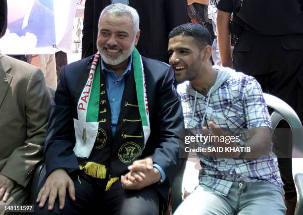 Palestinian Hamas premier in the Gaza Strip, Ismail Haniya meets with the freed football player Mahmud Sarsak in latter's house in Rafah town in the...