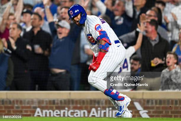 Nelson Velazquez of the Chicago Cubs hits a grand slam home run in the third inning against the Seattle Mariners at Wrigley Field on April 11, 2023...