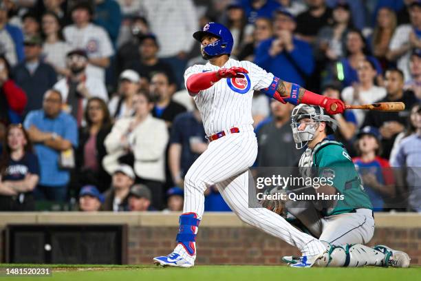 Nelson Velazquez of the Chicago Cubs hits a grand slam home run in the third inning against the Seattle Mariners at Wrigley Field on April 11, 2023...