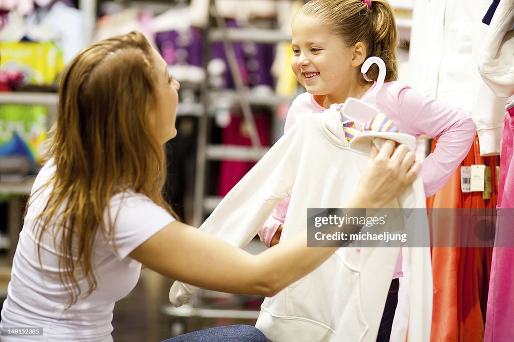 Mother and daughter shopping for clothes