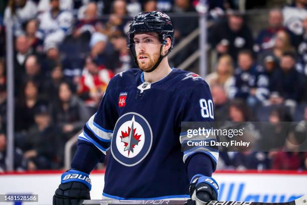 Pierre-Luc Dubois of the Winnipeg Jets looks on during a first period stoppage in play against the Calgary Flames at the Canada Life Centre on April...