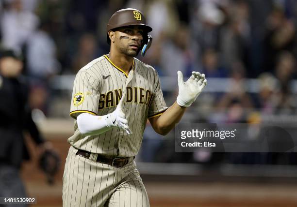 Xander Bogaerts of the San Diego Padres rounds first after hitting a two run home run in the ninth inning against the New York Mets at Citi Field on...