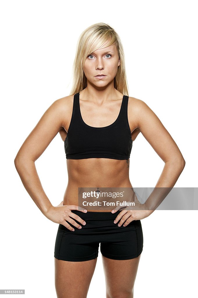 Healthy young woman in sports clothing