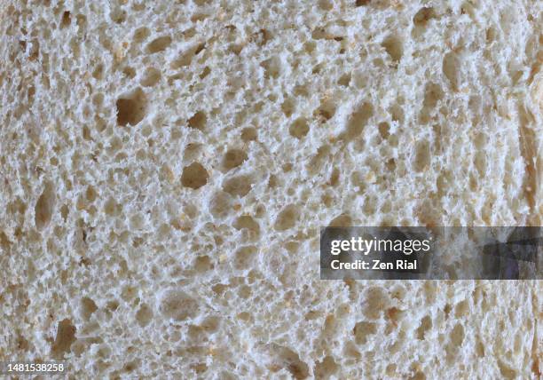 extreme close up of honey wheat bread in full frame - bread texture stockfoto's en -beelden