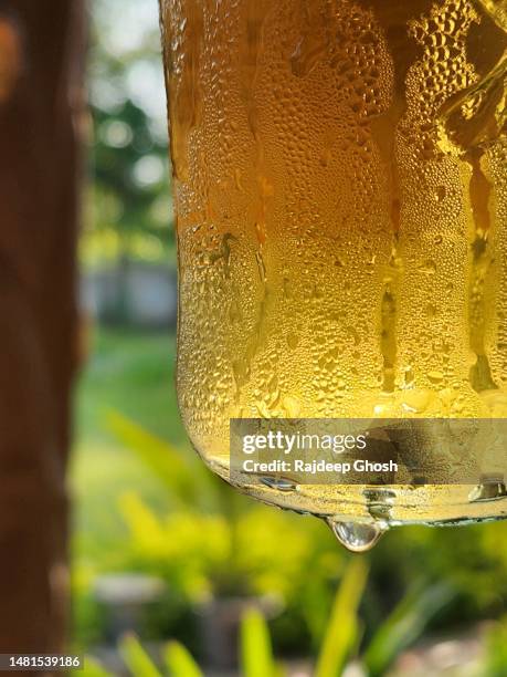 water droplets on beer bottle - bottle condensation stock pictures, royalty-free photos & images