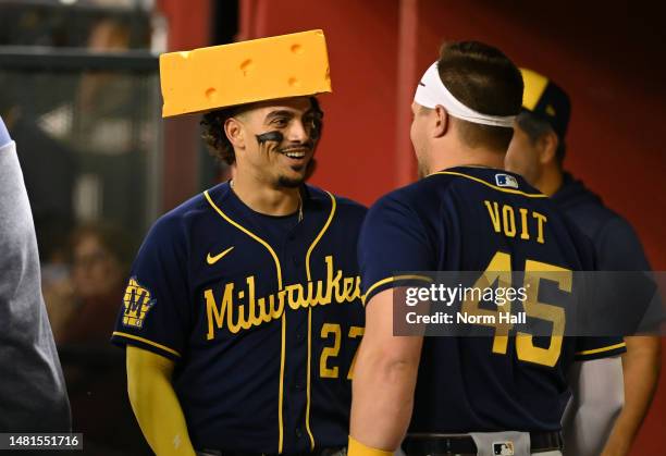 Willy Adames of the Milwaukee Brewers celebrates with Luke Voit after hitting a solo home run against the Arizona Diamondbacks during the seventh...