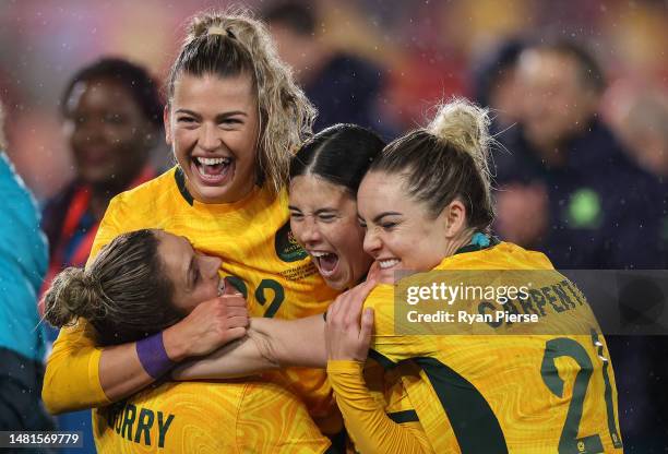 Charlotte Grant of Australia celebrates victory with teammates after defeating England during the Women's International Friendly match between...
