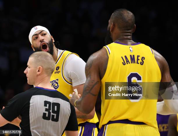 Anthony Davis of the Los Angeles Lakers reacts to LeBron James after his foul on Mike Conley of the Minnesota Timberwolves, resulting in three free...