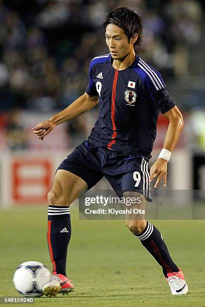 Kenyu Sugimoto of Japan controls the ball during the international friendly match between Japan U-23 and New Zealand U-23 at the National Stadium on...