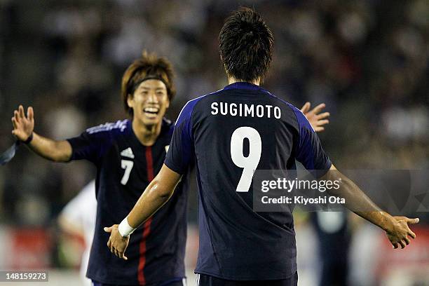 Kenyu Sugimoto of Japan celebrates his goal against New Zealand U-23 with his team-mate Yuki Otsu during the international friendly match between...