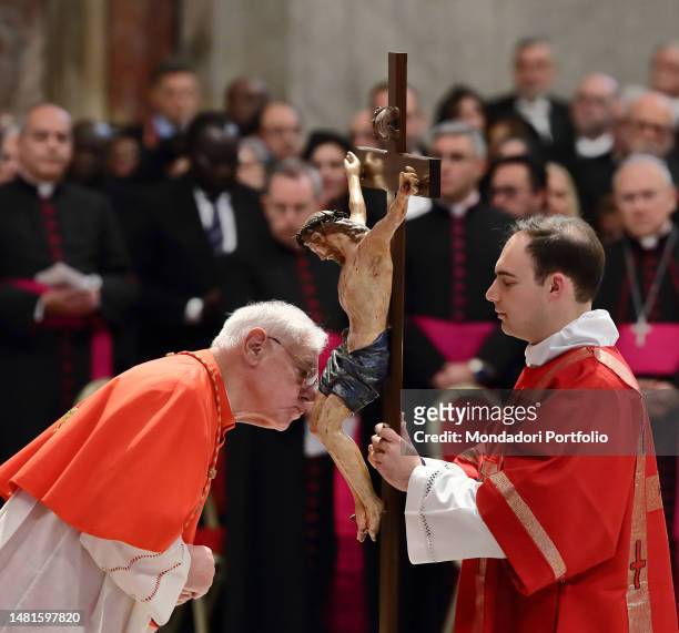 Cardinal Gerhard Ludwig Müller during the Adoration of the Cross for the celebration of the Passion of the Lord on Good Friday in St Peter's...