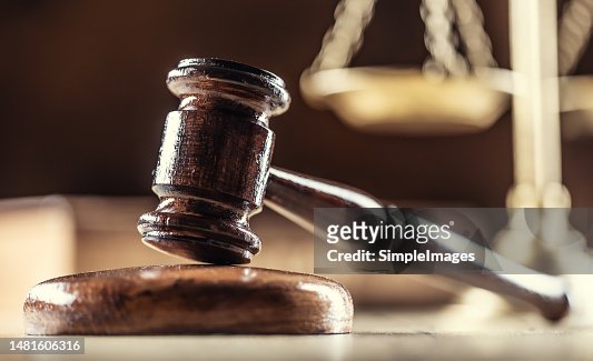 The judge's gavel and scales as a symbol of the judiciary and justice.