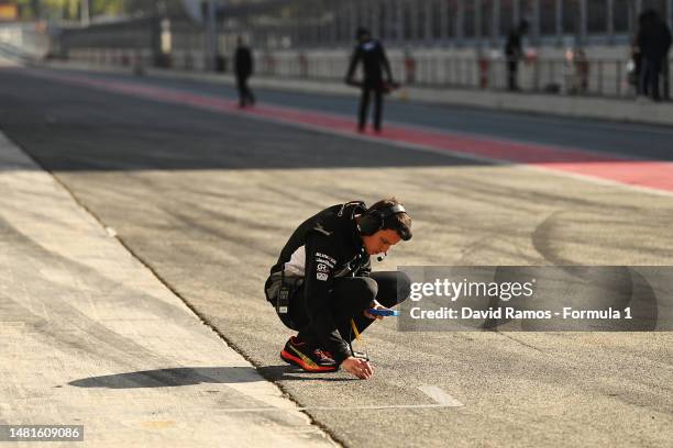 Campos Racing team member works in the Pitlane during day two of F1 Academy Testing at Circuit de Barcelona-Catalunya on April 12, 2023 in Barcelona,...