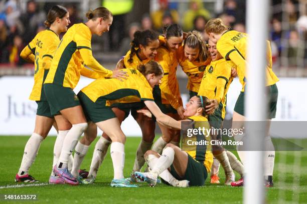 Charlotte Grant of Australia celebrates after scoring the team's second goal with teammates during the Women's International Friendly match between...