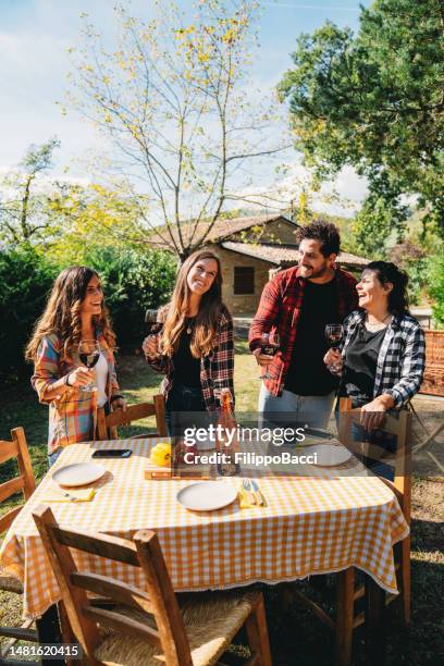 friends talking together at vineyard countryside dinner party - garden brunch bildbanksfoton och bilder