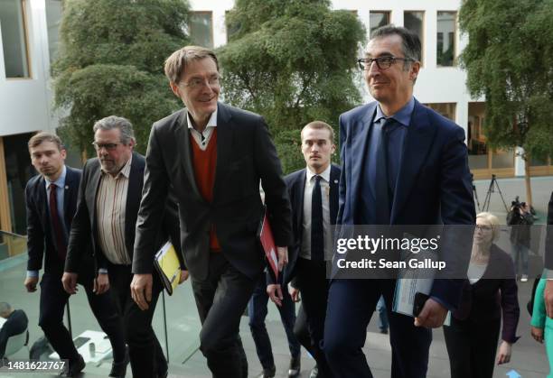 German Health Minister Karl Lauterbach and Agriculture Minister Cem Oezdemir arrive to speak to the media to present the governing coalition's new...