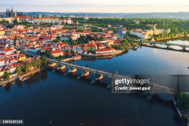 aerial view of charles bridge during sunrise in prague czech republic - st vitus's cathedral stock pictures, royalty-free photos & images