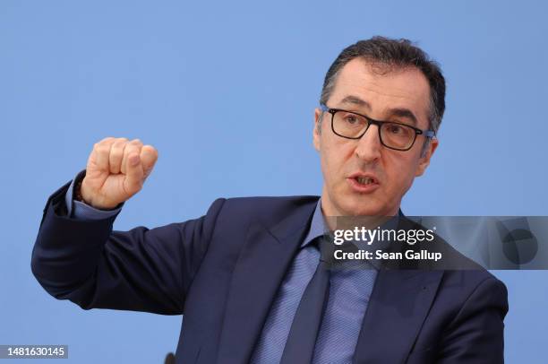 German Agriculture Minister Cem Oezdemir and Health Minister Karl Lauterbach speak to the media to present the governing coalition's new cannabis...