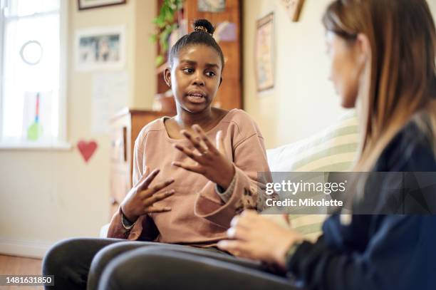 counseling, child and psychologist woman talking, support and help with problem, mental health or therapy consultation. listening, empathy and therapist person, african kid and school or life advice - teens talking stock pictures, royalty-free photos & images