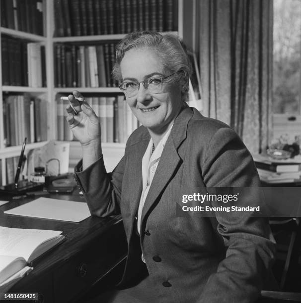 British literary critic and academic Helen Gardner seated in her office at St Hilda's College, Oxford University, on November 11th, 1959.