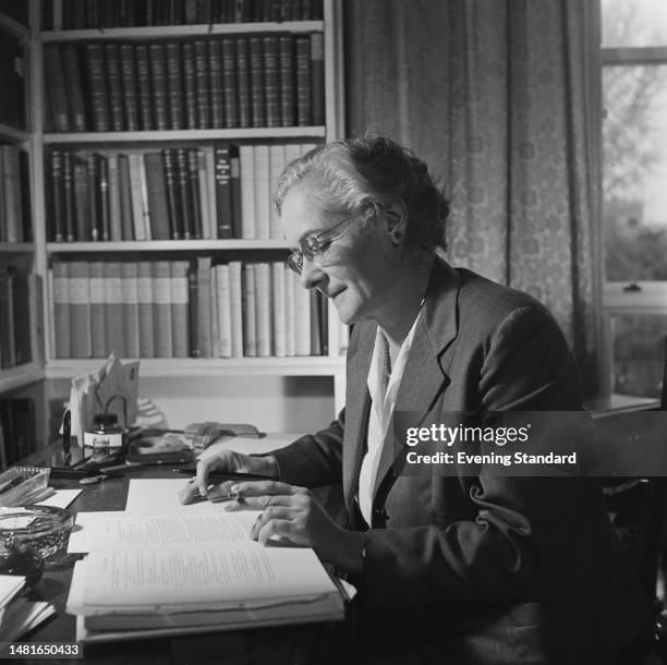 British literary critic and academic Helen Gardner seated at her desk in her office at St Hilda's College, Oxford University, on November 11th, 1959.