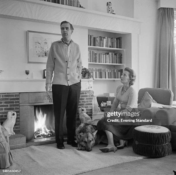 British actor Ian Carmichael and his wife Jean pictured in the living room of their London home on November 11th, 1959.