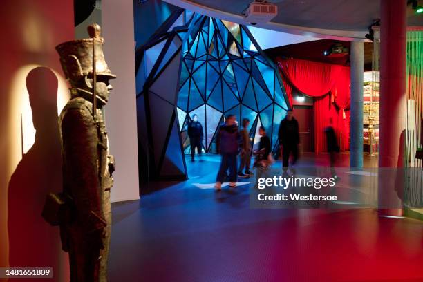 people visiting the museum trying out the interactive devices. - odense stock pictures, royalty-free photos & images
