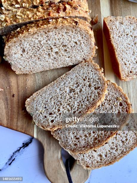 whole grain bread - spelt stock pictures, royalty-free photos & images