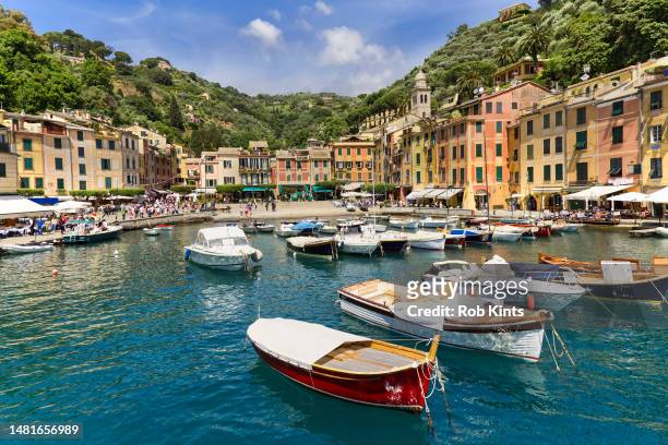 colorful houses and moored boats in the picturesque  harbor of portofino near genoa and camogli - genovia fotografías e imágenes de stock
