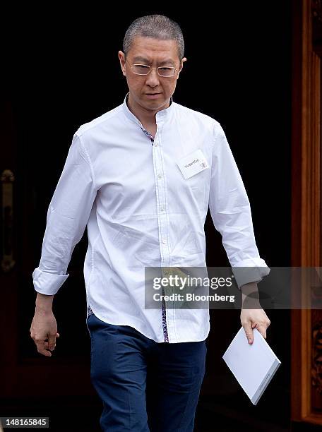 Victor Koo, chief executive officer of Youku Inc., leaves the morning session at the Allen & Co. Media and Technology Conference in Sun Valley,...