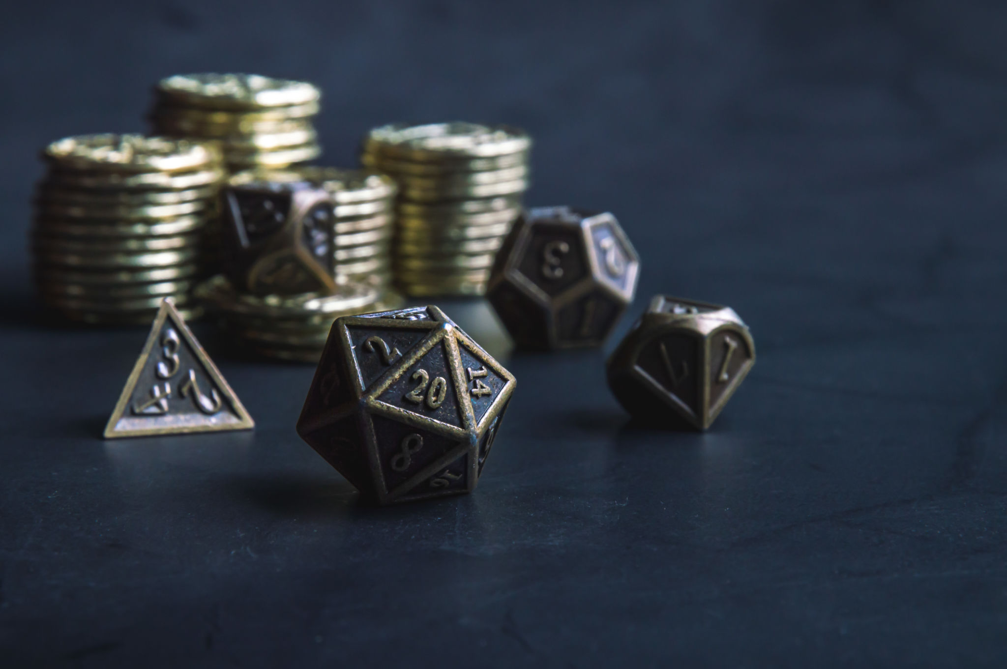 Close-up of a set of RPG dice and coins Close-up of a set of RPG dice and coins