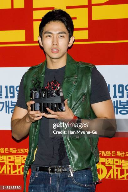 Seul-Ong of South Korean boy band 2AM attends the 'A Millionaire On The Run' VIP screening on July 11, 2012 in Seoul, South Korea. The film will open...