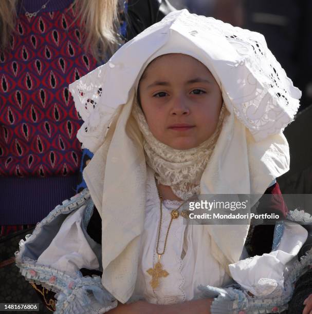 Little girl dressed in a traditional Sardinian dress during the General Audience in St. Peter's Square. Vatican City , April 12th, 2023.