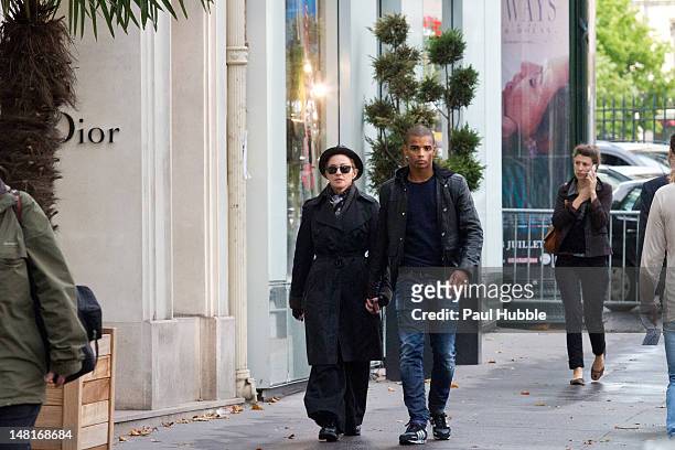 Madonna and Brahim Zaibat are seen on the 'Place de la Madeleine' on July 11, 2012 in Paris, France.