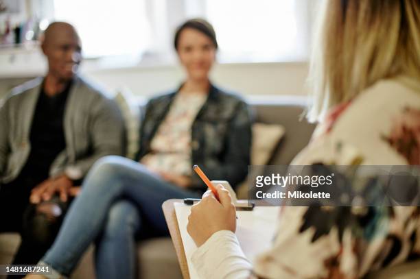 couple, therapy clipboard and woman marriage therapist in a counseling consultation. communication, listening and people at a psychology and support consulting appointment ready for conversation - alert 3 stock pictures, royalty-free photos & images