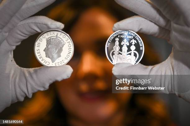 The commemorative £5 coin is seen at The Royal Mint, on April 12, 2023 in Pontyclun, Wales. The Royal Mint display their Coronation commemorative £5...