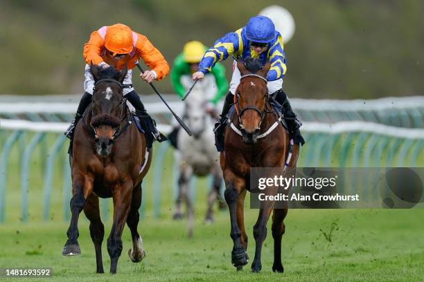 Harry Davies riding Rajinsky win The Barry Hills Further Flight Stakes from Hollie Doyle and Trueshan at Nottingham Racecourse on April 12, 2023 in...