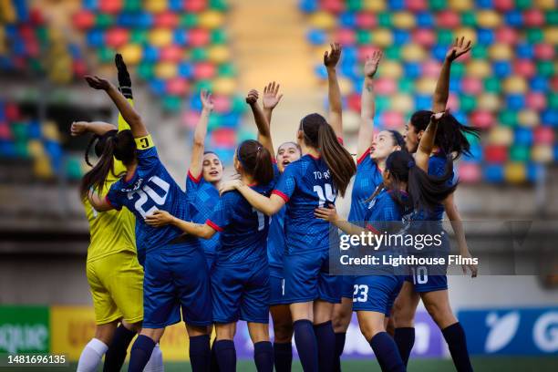 cheerful team of women soccer players break after successful pregame huddle - pre game huddle stock pictures, royalty-free photos & images