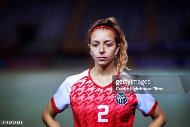 portrait of an attractive young female soccer player before a game - football player face stock pictures, royalty-free photos & images