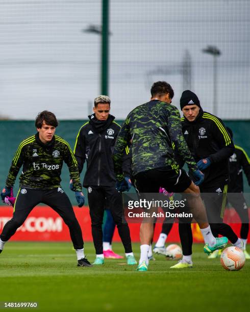 Facundo Pellistri, Antony, Victor Lindelof of Manchester United in action during a first team training session ahead of their UEFA Europa League...