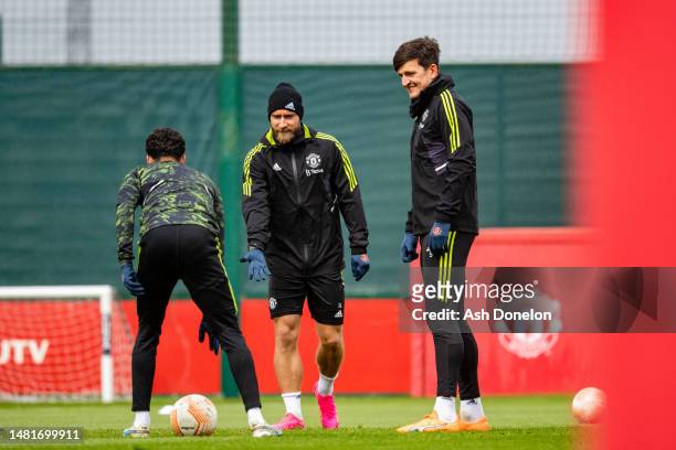 Christian Eriksen, Harry Maguire of Manchester United in action during a first team training session ahead of their UEFA Europa League quarterfinal...