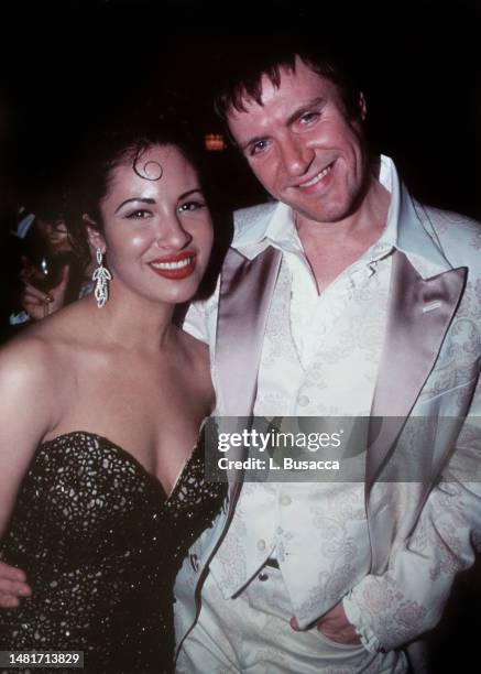 Singer Selena poses with Singer Simon Le Bon of Duran Duran during the EMI records Post-Grammy Party at Rex on March 2, 1994 in Los Angeles, CA.