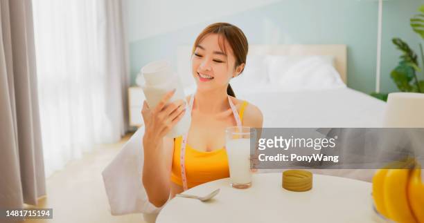 woman drink enzyme powder - sports ground stock pictures, royalty-free photos & images