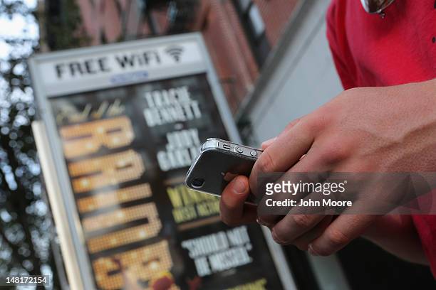 Dutch tourist Bas Derksen surfs the internet while at a free Wi-Fi hotspot on July 11, 2012 in Manhattan, New York City. New York City launched a...