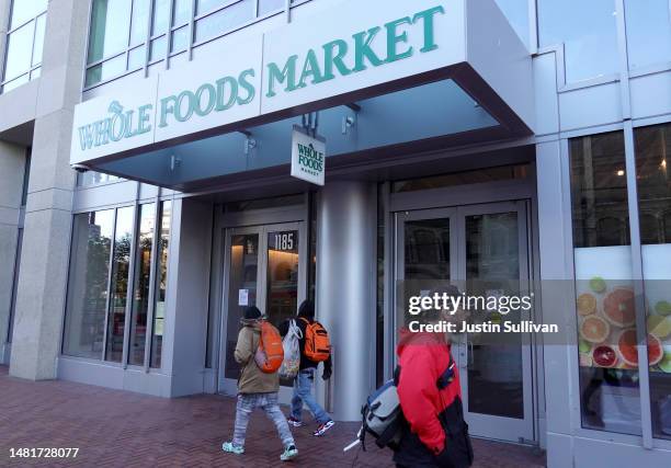Pedestrians walk by a closed Whole Foods store on April 12, 2023 in San Francisco, California. Whole Foods has temporarily closed one of its San...