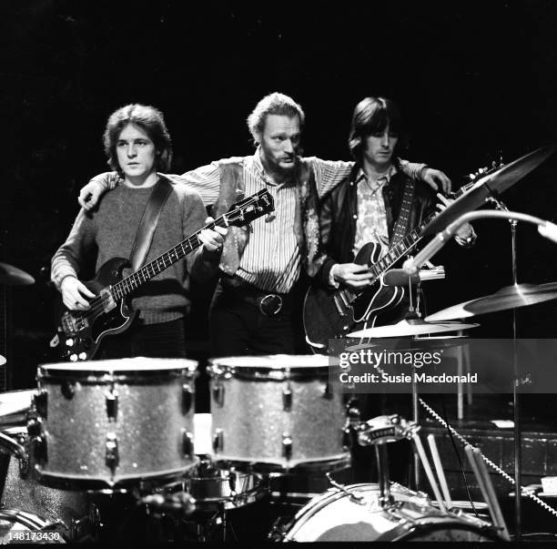 26th NOVEMBER: L-R, Jack Bruce, Ginger Baker and Eric Clapton from Cream pose together on stage during their farewell performance at the Royal Albert...