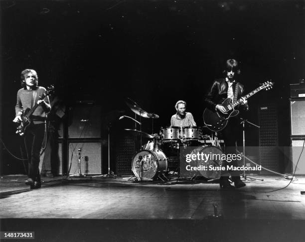 26th NOVEMBER: L-R, Jack Bruce, Ginger Baker and Eric Clapton from Cream perform live on stage during their farewell performance at the Royal Albert...